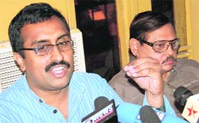 RSS central executive member Ram Madhav (left) stresses a point at a press conference in Jammu
