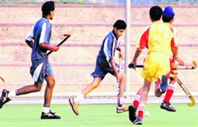 Players in action during Punjab State Inter-Distt Hockey League at PAU in Ludhiana