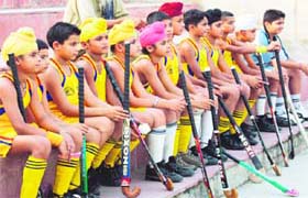 Young players watch the ongoing match at PAU in Ludhiana