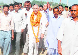 Former BJP president Jai Ram Joshi during a “padyatra” in the New Kumhar Colony in Chandigarh on Monday.