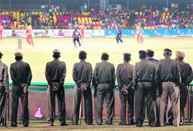 Haryana policemen watch the match at Panchkula on Monday.