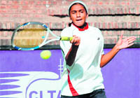 Parminder Kaur hits the ball during the Asian Juniors Tennis Circuit held at the Sector-10 Tennis Stadium, Chandigarh, on Monday.