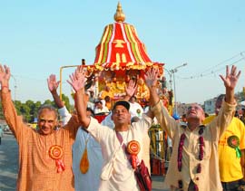 Devotees take out aJagannath Rath Yatra in New Delhi on Monday. 