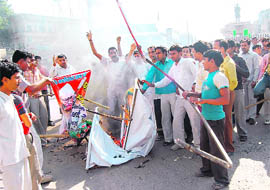 Youths stage a protest in Bhiwani on Monday against the killing of a student by the police.