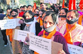Activists of the Vishwa Hindu Parishad hold a protest against terrorism and in favour of sadhvi Pragya Singh covering mouth with black cloth at Shimla on Monday.