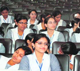 Students take a nap during a debate contest at Nehru Sidhant Kendar in Ludhiana