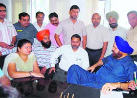 Senior deputy mayor Praveen Bansal along with other municipal councillors during a meeting with mayor in Ludhiana