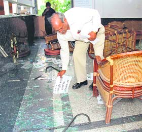 Police personnel at Maharashtra Sadan after a attack by miscreants in New Delhi