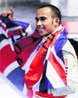 McLarens Formula One driver Lewis Hamilton of Britain celebrates after winning the 2008 Championship at the Brazilian GPin Sao Paulo