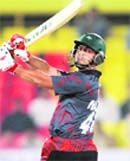 Nazimuddin of Dhaka Warriors hits a six in the match against Ahmedabad Rockets.