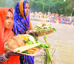 Devotees performing rituals during the Chhath puja on the banks of the Sirhind canal in Bathinda on Tuesday.