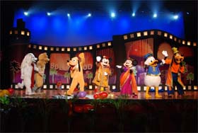 Cartoon characters Mickey, Minnie and others perform at a programme in New Delhi