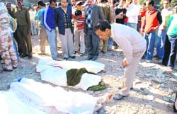 People gathered around bodies of bus mishap victims near Kufri in Shimla