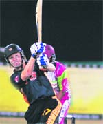 Royal Bengal Tigers' Hamish Marshall slams a six against Chennai Superstars in the ICL match at Panchkula