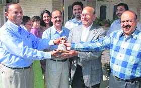 Dr Krishan Goyale (second from right) celebrates the victory of his son Democrat Raj Goyale at his nephews house in Panchkula