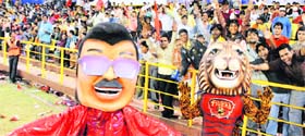 Mascotmen cheer the crowd during an ICL match