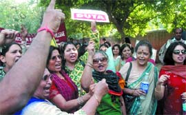 Teachers of central universities demonstrate against Chadha Committee's acts of misdemeanourin New Delhi on Wednesday. 