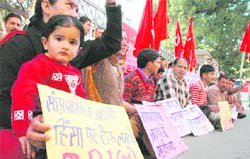 Activists of the CPM raise slogans against terrorism and communalism at Shimla