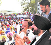 BJP MP Navjot Singh Sidhu addresses a rally at the Rajasansi International Airport in Amritsar on Wednesday.