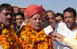 Congress candidate Raj Kumar Gaur speaks to media persons after reaching Sriganganagar on Thursday.