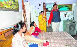Hostel superintendent Vijay Jaiswal with his family, after they were allegedly locked inside the house by school authorities
