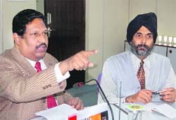 IRDE director S.S. Sundram (L) addresses mediapersons. 