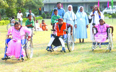 Special children participate in a wheelchair race at Trinity College in Jalandhar on Thursday.