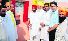 Minister for jails, tourism and cultural affairs Hira Singh Gabria inaugurates a cowshed at Shri Radha Krishan Gaushala Kaind, near Ahmedgarh, on Thursday.