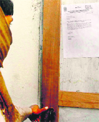 Legal notice pasted outside the house of Vijay Jaiswal.