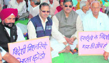 Activists of Hindu organisations stage a protest in Dehradun on Friday.