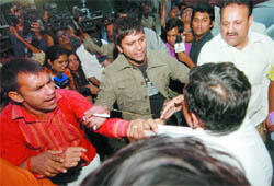 Supporters of BJP leader Vijay Jolly clash with those of Poonam Azad, who resigned from the saffron party yesterday, at a meeting in New Delhi on Friday.