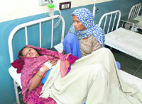 Kanta in the trauma centre in Karnal on Friday after her in-laws forcibly got her aborted.