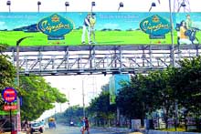 A surrogate liquor advertisement billboard put up on a foot bridge near bus stand in Jalandhar. 