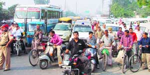 People wait for hours for the Chief Ministers cavalcad to pass the GT Road in Ludhiana 