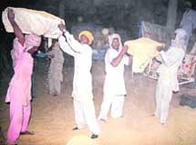 Farmers lift paddy from the Bathinda market on Friday. 