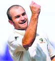 Jason Krejza celebrates the wicket of India's Amit Mishra. Krejza took eight wickets for 215 runs