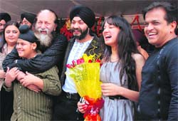 The cast of Punjabi film Sat Sri Akal at its premiere at Kiran cinema-22 on Friday