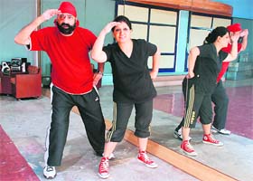 Jaspal Bhatti and Savita Bhatti rehearse for their next act in ‘Nach Baliye’ at Joke Factory, Mohali