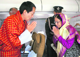 The 4th King of Bhutan, H.M. Jigme Singye Wangchuck, seeing off President Pratibha Patil, inside the aircraft at Paro airport in Bhutan on Saturday.