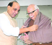 BJP prime ministerial candidate L.K. Advani being offered a shawl by BJP president Rajnath Singh on his birthday in New Delhi on Saturday.