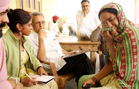 Paramjeet Kaur, whose family members died of cancer, narrates her woes to Neeta Kang and M.S. Kang at Kotbhai village in Muktsar district
