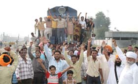 Protesters blocking the railway track in Bathinda