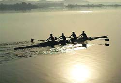 The rising sun makes for a pleasant background at the Sukhna Lake in Chandigarh on Sunday.