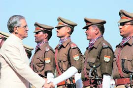 Uttarakhand Governor B.L. Joshi greets parade commanders on the State Foundation Day.