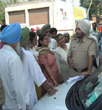 Cops have a word with kin of NRI Sarabjit Singh in Nawanshahr on Sunday.