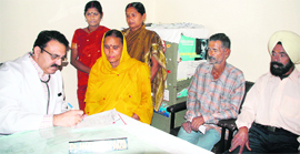 A doctor prescribes medicines to a patient at the newly opened psychiatry OPD at Govt Medical College, Jammu.
