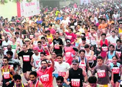 Participants at the Delhi Half Marathon on Sunday. 
