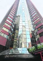 In this file photo, office of troubled insurer American International Group Inc. is shown in Manhattan area of New York. The US government on Monday announced the restructuring of the government's $85-billion financial aid package that was given to insurer AIG in September. Under the restructuring, the US Treasury will purchase $40 billion of newly issued AIG preferred shares under the Troubled Asset Relief Programme. 