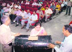 A draw of lots for the CHBs Sector 63 scheme being held in Chandigarh on Monday. 