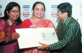 Kiran Bedi (Right) with FLO president Anuradha Goel (Left) and Meera Handa (Centre), postmaster general, Delhi circle, Govt. of India, releases the special postal cover commemorating the silver jubilee of the FLO in New Delhi